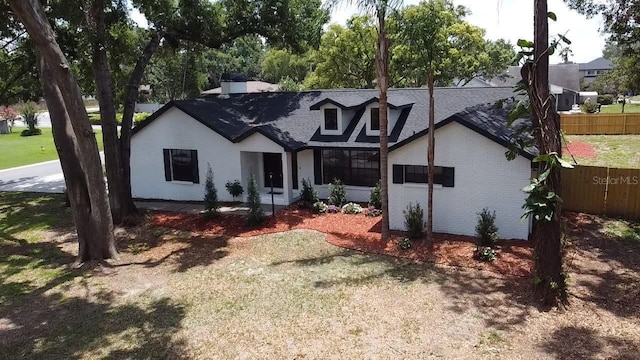 2715 Willow Oaks Dr, Valrico, FL 33594 - view of front facade with roof with shingles and brick siding