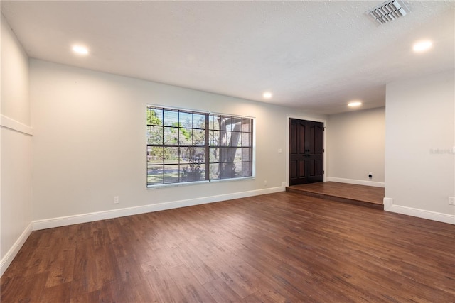 2715 Willow Oaks Dr, Valrico, FL 33594 - unfurnished room with dark wood-type flooring, recessed lighting, and baseboards