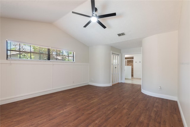2715 Willow Oaks Dr, Valrico, FL 33594 - empty room with wood finished floors, a ceiling fan, lofted ceiling, wainscoting, and baseboards