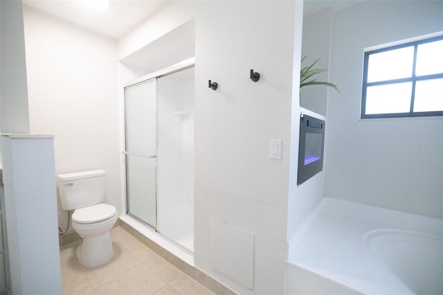 2715 Willow Oaks Dr, Valrico, FL 33594 - bathroom with toilet, a stall shower, and tile patterned floors