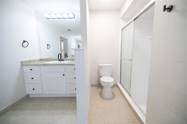 2715 Willow Oaks Dr, Valrico, FL 33594 - bathroom featuring toilet, vanity, a stall shower, tile patterned flooring, and baseboards