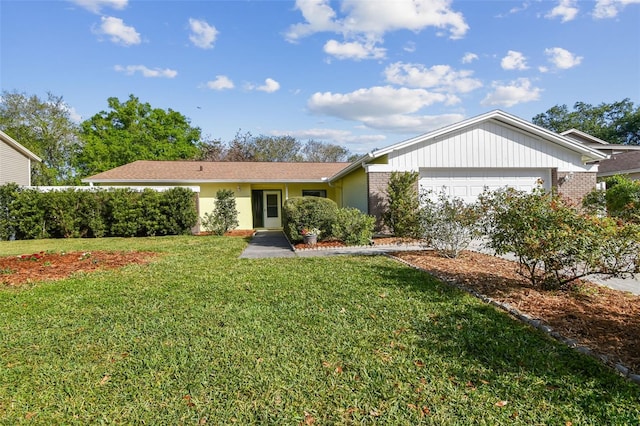 single story home featuring a front yard and an attached garage