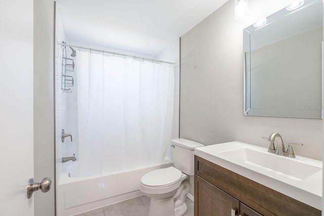 bathroom featuring tile patterned floors, toilet, vanity, and shower / bath combo