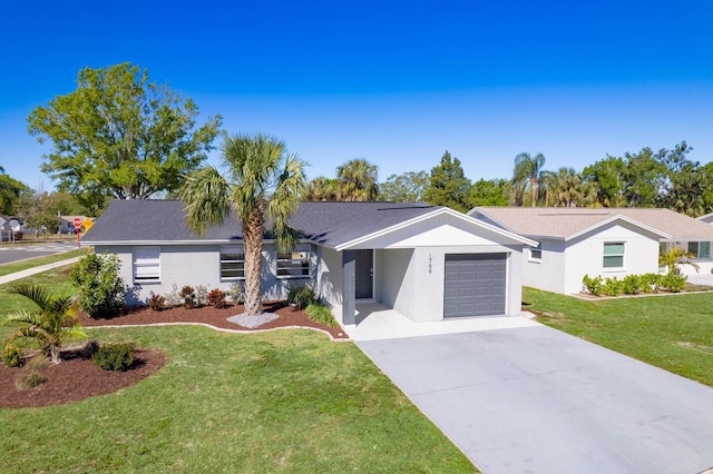 view of front facade featuring concrete driveway, an attached garage, a front yard, and stucco siding