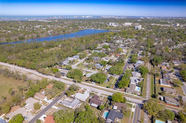 birds eye view of property with a water view and a residential view