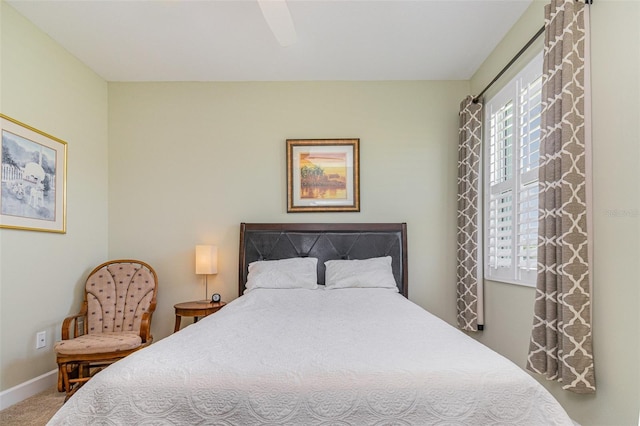 689 Chipper Dr, Sun City Center, FL 33573 - carpeted bedroom with a ceiling fan and baseboards