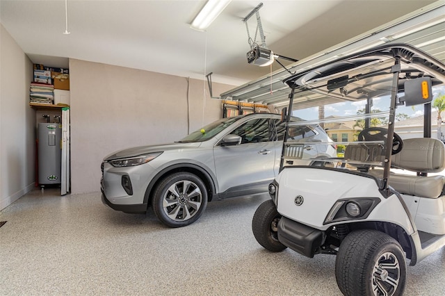 689 Chipper Dr, Sun City Center, FL 33573 - garage with electric water heater and a garage door opener