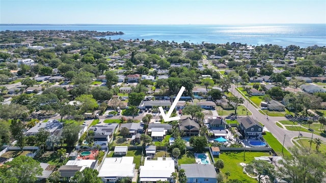 drone / aerial view featuring a residential view and a water view