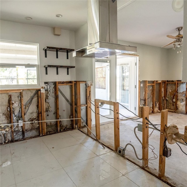 interior space featuring ceiling fan