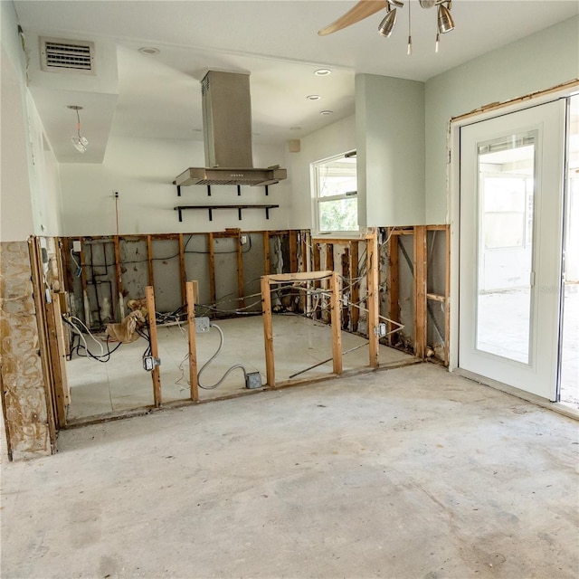 miscellaneous room featuring visible vents and concrete flooring