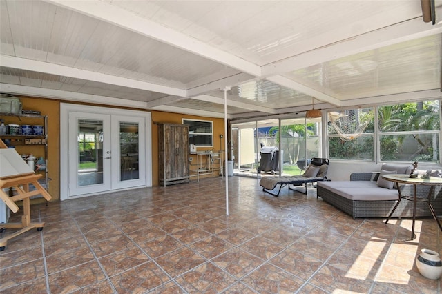 sunroom with french doors and beamed ceiling