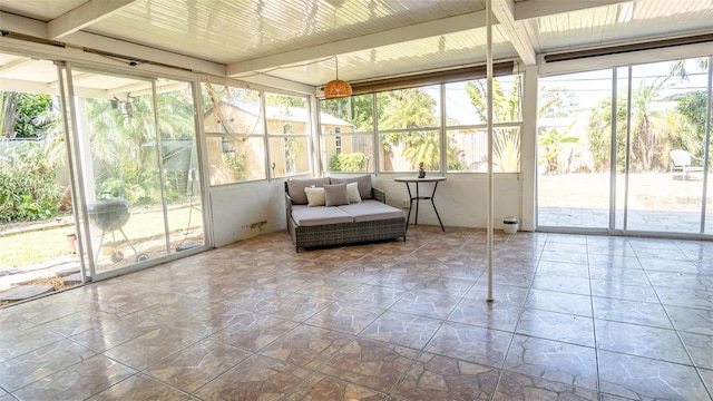 sunroom with beam ceiling