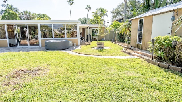 view of yard with a sunroom