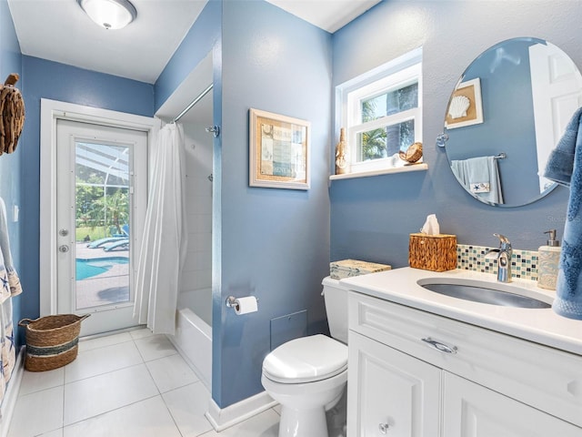 13420 Rustic Pines Blvd S, Seminole, FL 33776 - full bath with toilet, healthy amount of natural light, tile patterned flooring, and vanity