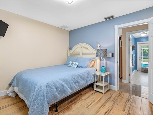 13420 Rustic Pines Blvd S, Seminole, FL 33776 - bedroom with wood finished floors and baseboards