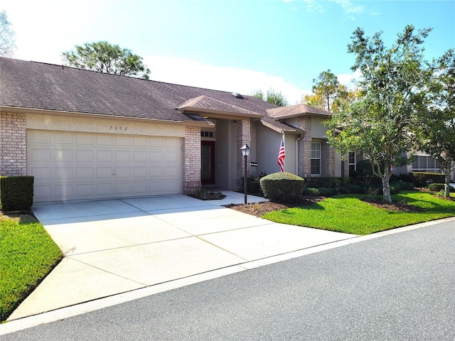 7392 Meadow Brook Ln, Spring Hill, FL 34606 - view of front of house with a garage, concrete driveway, brick siding, and a front lawn