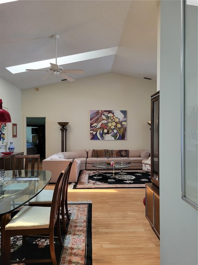7392 Meadow Brook Ln, Spring Hill, FL 34606 - dining space with a skylight, lofted ceiling, light wood finished floors, and a ceiling fan