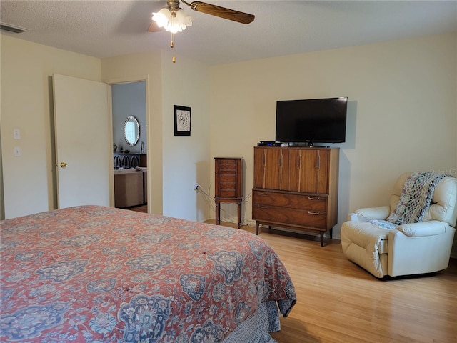 7392 Meadow Brook Ln, Spring Hill, FL 34606 - bedroom featuring wood finished floors and a ceiling fan