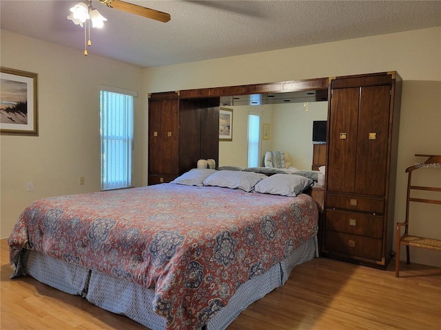 7392 Meadow Brook Ln, Spring Hill, FL 34606 - bedroom featuring wood finished floors and a ceiling fan