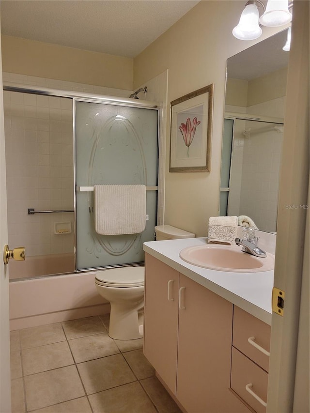 7392 Meadow Brook Ln, Spring Hill, FL 34606 - full bath featuring vanity, toilet, tile patterned flooring, and enclosed tub / shower combo