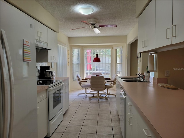 7392 Meadow Brook Ln, Spring Hill, FL 34606 - kitchen featuring white appliances, under cabinet range hood, a textured ceiling, a sink, and a ceiling fan