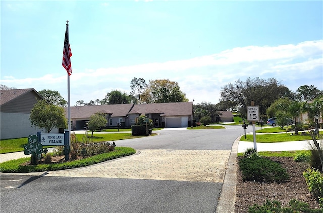 7392 Meadow Brook Ln, Spring Hill, FL 34606 - view of asphalt road featuring traffic signs and curbs