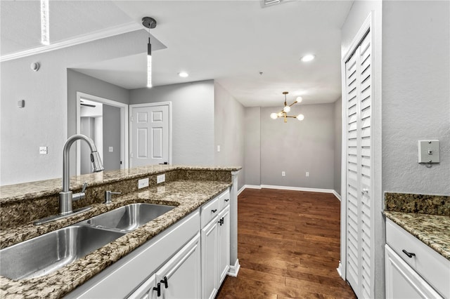 700 S Harbour Island Blvd Unit 240, Tampa, FL 33602 - kitchen featuring dark wood finished floors, stone countertops, a sink, white cabinetry, and a notable chandelier