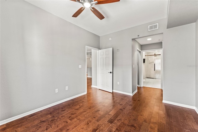 700 S Harbour Island Blvd Unit 240, Tampa, FL 33602 - unfurnished bedroom with visible vents, connected bathroom, baseboards, a ceiling fan, and wood-type flooring