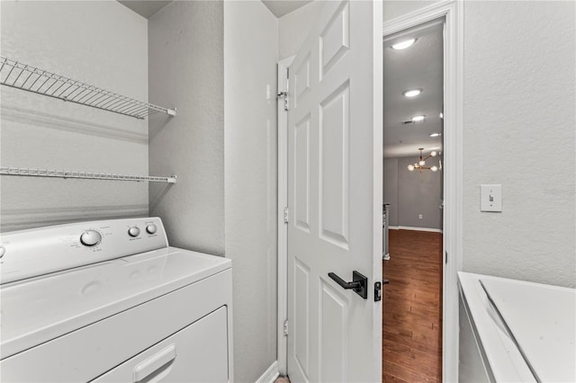 700 S Harbour Island Blvd Unit 240, Tampa, FL 33602 - laundry room with washer / dryer, wood finished floors, laundry area, and a textured wall