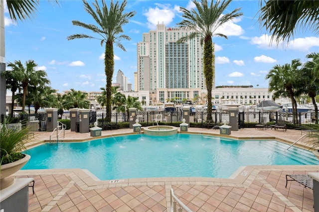 700 S Harbour Island Blvd Unit 240, Tampa, FL 33602 - pool featuring a patio, a view of city, fence, and a community hot tub