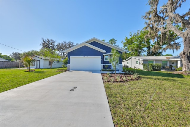 ranch-style house with a garage, a front yard, and driveway