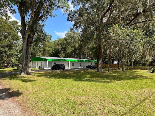 5562 S US-301, Bushnell, FL 33513 - view of yard featuring a carport