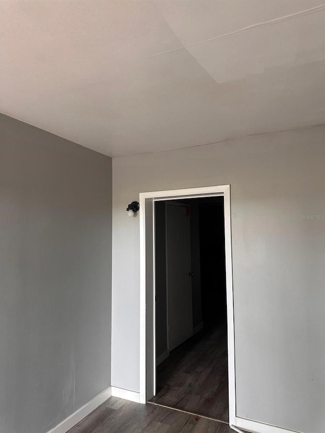 5562 S US-301, Bushnell, FL 33513 - spare room with baseboards and wood finished floors