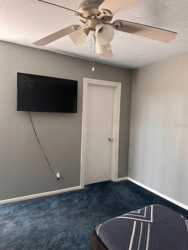 5562 S US-301, Bushnell, FL 33513 - unfurnished room with a textured ceiling, baseboards, carpet floors, and ceiling fan