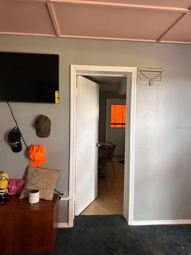 5562 S US-301, Bushnell, FL 33513 - hallway with tile patterned flooring, carpet flooring, and baseboards