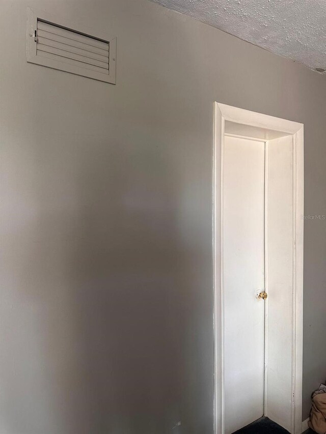 5562 S US-301, Bushnell, FL 33513 - interior space with visible vents and a textured ceiling