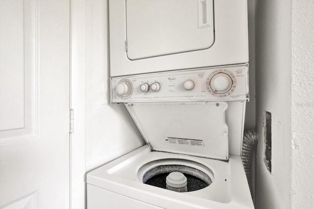 1301 S Howard Ave Unit B24, Tampa, FL 33606 - laundry room featuring stacked washing maching and dryer and laundry area