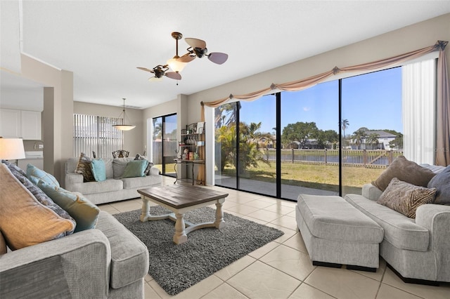 living room featuring light tile patterned floors and a ceiling fan