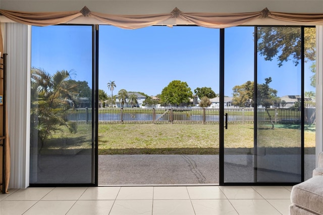 unfurnished sunroom featuring a healthy amount of sunlight and a water view