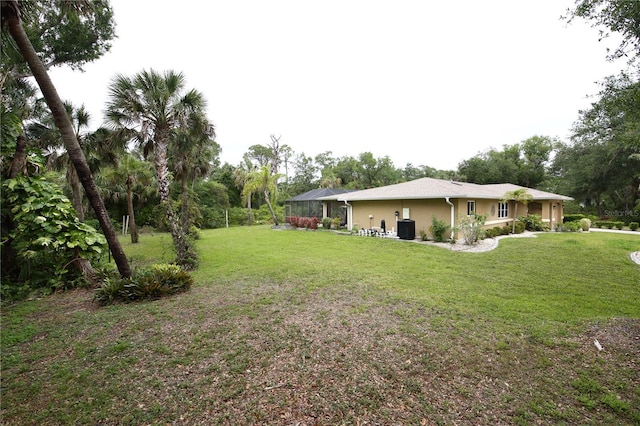view of yard featuring a lanai