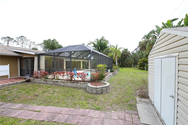view of yard with a lanai and an outdoor pool