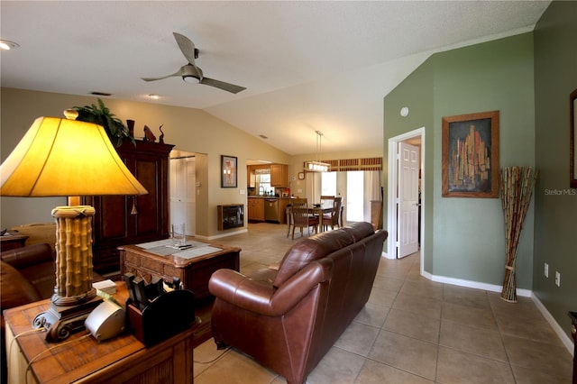 living room featuring light tile patterned floors, ceiling fan, baseboards, and lofted ceiling