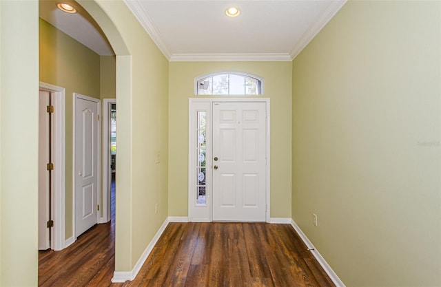 15925 Pond Rush Ct, Land O Lakes, FL 34638 - entrance foyer with arched walkways, healthy amount of natural light, wood finished floors, crown molding, and recessed lighting