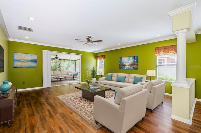 15925 Pond Rush Ct, Land O Lakes, FL 34638 - living area featuring decorative columns, plenty of natural light, a ceiling fan, crown molding, and wood finished floors