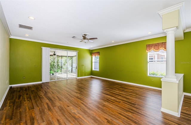 15925 Pond Rush Ct, Land O Lakes, FL 34638 - empty room with decorative columns, plenty of natural light, a ceiling fan, wood finished floors, and crown molding