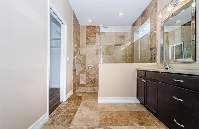 15925 Pond Rush Ct, Land O Lakes, FL 34638 - full bath with a walk in shower, vanity, a walk in closet, and recessed lighting