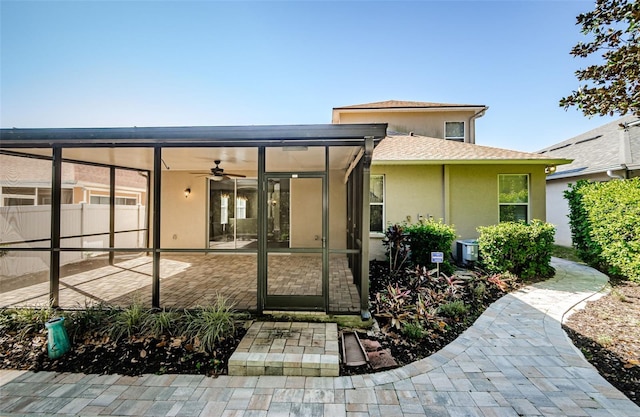 15925 Pond Rush Ct, Land O Lakes, FL 34638 - back of house with a ceiling fan, a patio area, and stucco siding