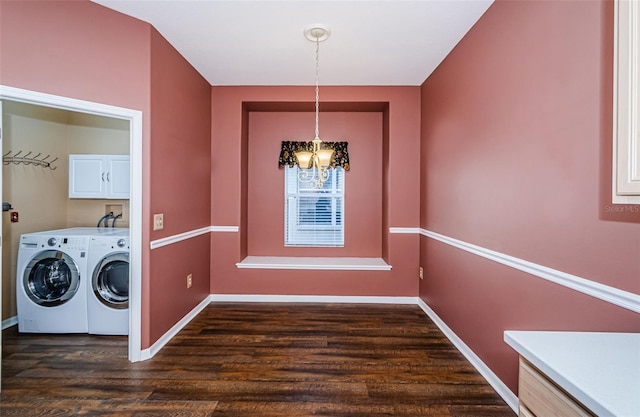 15925 Pond Rush Ct, Land O Lakes, FL 34638 - laundry area featuring separate washer and dryer, cabinet space, a chandelier, and dark wood-style floors