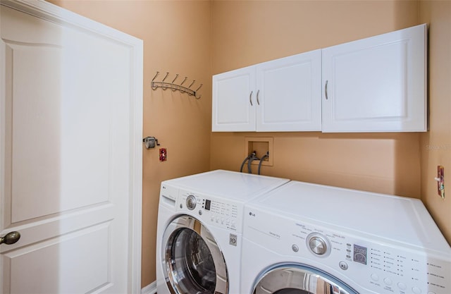 15925 Pond Rush Ct, Land O Lakes, FL 34638 - laundry area featuring independent washer and dryer and cabinet space