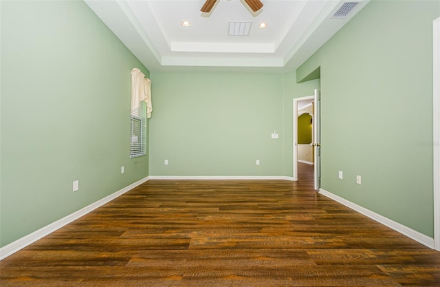 15925 Pond Rush Ct, Land O Lakes, FL 34638 - unfurnished room with a raised ceiling, ceiling fan, recessed lighting, and dark wood-style floors